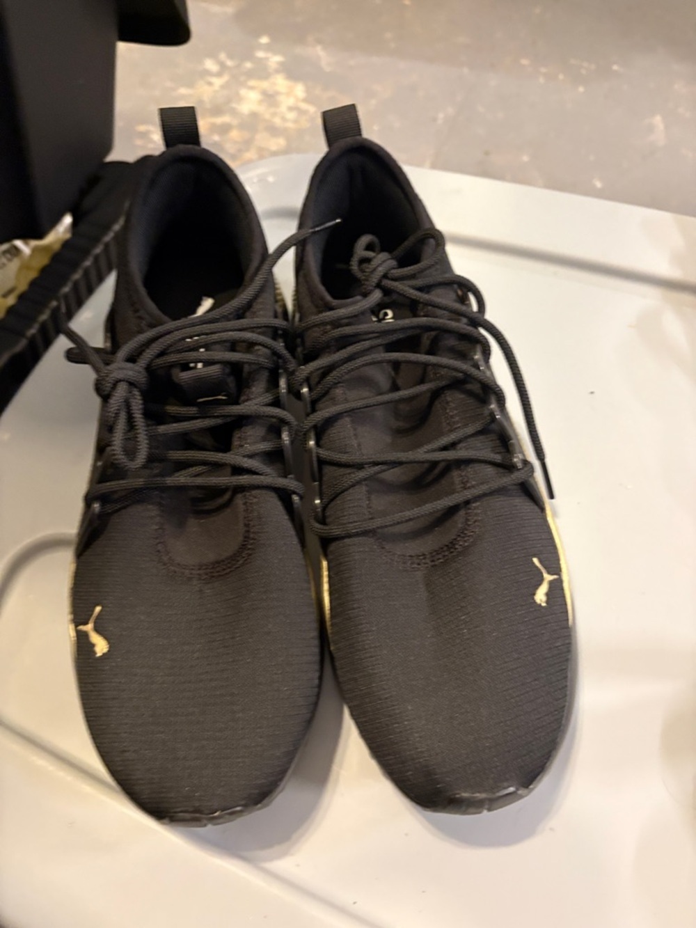 Puma Men’s Black Athletic Sneakers with Gold Logo Accents